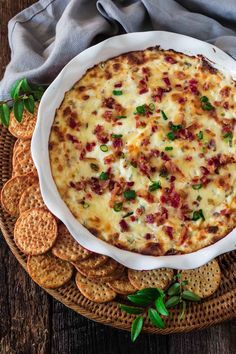 a cheese and bacon dip surrounded by crackers