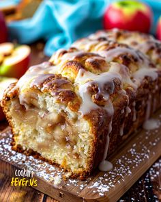 a loaf of cinnamon apple bread sitting on top of a cutting board