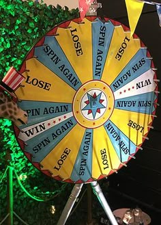 a colorful carnival wheel with an american flag and giraffe on it's side