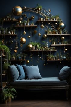 a living room filled with lots of plants and gold balls hanging from the wall above it