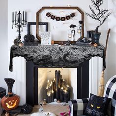 a living room decorated for halloween with black and white decor