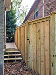 a wooden fence with steps leading up to it