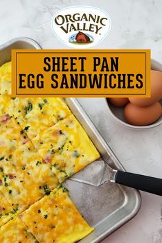 an egg pan with eggs in it and the words sheet pan egg sandwiches