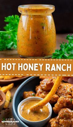 hot honey ranch sauce in a glass jar next to fries and dipping sauce on the side