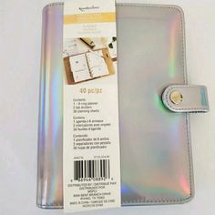 the inside of a silver wallet with a tag on it