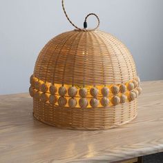 a wicker basket sitting on top of a wooden table