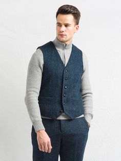 Its timeless quality makes this waistcoat well worth investing in if you have a penchant for classic Irish Design. Perfect for those days when it's too warm for a coat but you want an extra layer! Beautifully tailored for a perfect fit, six button closure and Blue Herringbone tweed with flecks of golden autumnal colours, it is perfect for an all year round appeal. Available Sizes in stock now: 38, 40, 42, 44, 46, 48 A stunning sea blue herringbone tweed vest 2 fully functional pockets 6 button f Winter Business Tweed Vest, Winter Formal Vest For Business, Blue Tweed Jacket With Welt Pockets, Formal Tweed Vest For Winter, Formal Winter Tweed Vest, Classic Blue Tweed Outerwear, Blue Tweed Jacket With Pockets, Business Tailored Tweed Vest, Blue Tweed Jacket With Welt Pockets For Winter