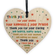 a wooden heart hanging on a string with the words, miss tomkins just a little thank you for everything you have done