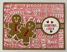 a close up of a greeting card with two gingers on it and the words sending cheer