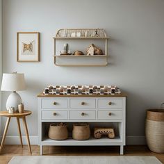 a baby crib in the corner of a room with two shelves and baskets on it