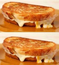 grilled cheese sandwich sitting on top of a brown plate with melted cheese and sauce