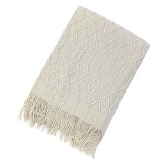 a white blanket with fringes on it