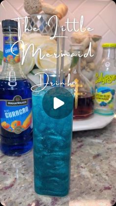 a blue drink sitting on top of a counter