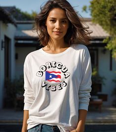 Experience the vibrant Boricua Vibes with this long sleeve tee! Made with environmentally-friendly cotton, this tee gives a thicker vintage feel. Perfect for those who want to show off their Puerto Rican pride or anyone looking for a unique and stylish long sleeve tee. Ideal for celebrating Puerto Rican Day Parade, Hispanic Heritage Month, or everyday wear. Product features - Environmentally-friendly manufactured cotton for a vintage feel - Knit in one piece without side seams for reduced fabric Casual Long Sleeve Graphic T-shirt, Long Sleeve Printed Cotton Sweatshirt, Printed Long Sleeve Cotton Sweatshirt, Printed Cotton Long Sleeve Sweatshirt, White Long Sleeve Graphic T-shirt, White Long Sleeve Tops With Graphic Print, White Long Sleeve Top With Graphic Print, Long Sleeve Shirt With Screen Print For Streetwear, Long Sleeve Graphic Tee For Streetwear