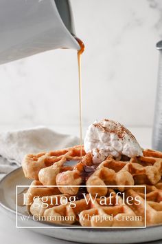 waffles are being drizzled with icing on a white plate