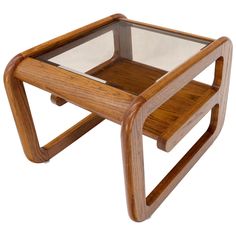 a wooden and glass side table on white background