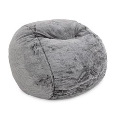 a grey bean bag chair sitting on top of a white floor