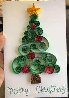 a handmade christmas tree card with spirals and a star on top that says merry christmas