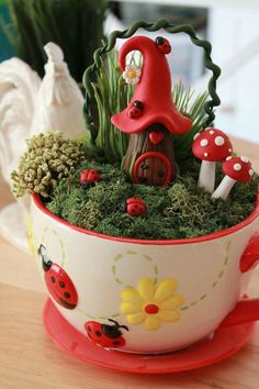 there is a pot that has some plants in it and a mushroom on the top