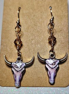 Handmade Cowboy Cow Skull earrings in a beautiful grey design. These are a favorite with Crystal beads. Grey Design, Western Earrings, Bull Skull, Bull Skulls, Cow Skull, Shades Of Brown, Skull Earrings, Gray Design, Jewelry Earrings Hoops