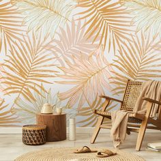 a chair and rug in front of a wall with palm leaves on it