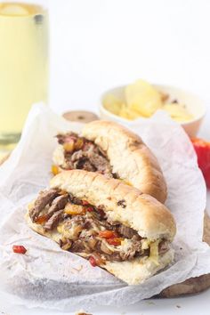 two sandwiches sitting on top of wax paper