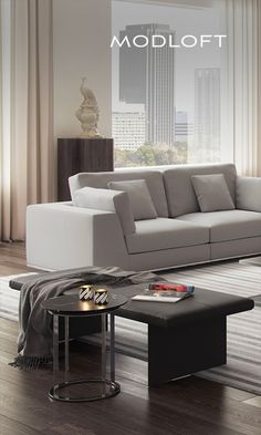 a modern living room with white furniture and wood flooring is featured in this ad for modloft