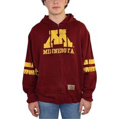 Feel The Embrace Of Cozy Warmth With The Izod Mens Collegiate Full Zip Hooded Sweatshirt. With Its Manufacturing Origins Unknown, This 100% Cotton Sweatshirt Becomes An Emblem Of Casual Grace. The Minnesota Graphic Across The Front, Dual Kangaroo Pockets, And Full-Zipped Front Come Together To Create A Look That's Both Chic And Functional.The Drawstring Closure At The Top Adds A Personalized Touch, While The Long Sleeves Keep You Snug And Comfortable. Perfect For A Casual Outing Or A Lazy Day At Cotton Hoodie For Fan Gear, Cotton Throwback Sweatshirt For Fan Gear, Cotton Throwback Fan Gear Sweatshirt, Cotton Hoodie With Double-lined Hood For Fan Gear, Winter Cotton Hoodie For Fan Gear, Collegiate Cotton Hooded Hoodie, Collegiate Cotton Hooded Sweatshirt, Cotton Fan Apparel Hoodie With Double-lined Hood, Cotton Hoodie With Double-lined Hood For Fans