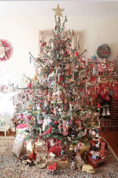 a christmas tree with presents under it in a living room