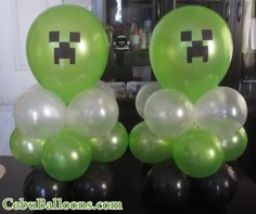 some balloons that have been made to look like an emoticant face on them