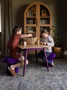 Combine the Ruben Play Table with soft mushrooms stools for extra comfort and fun. Ruben play table with two mushroom stools are designed to enhance playtime while keeping toys and essentials organized. This charming play table and mushrooms features a sturdy solid oak wooden construction that ensures durability, comfort and safety. Select from a charming palette of colors, featuring marigold, navy, black and natural, to envelop your child in their preferred shade and build a tranquil haven suit Mushroom Stool, Childcare Rooms, Table And Two Chairs, Play Cube, Wooden Construction, Play Table, Activity Table, French Chairs, Home Goals