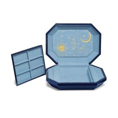 an open blue box with the lid opened and it's inside filled with jewelry