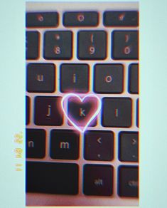 a computer keyboard with a heart drawn on it