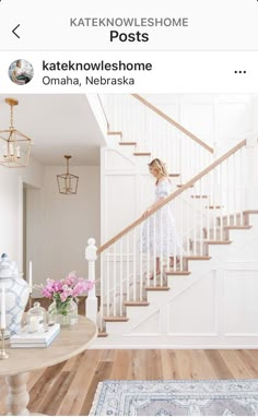 a girl standing on the stairs in her home