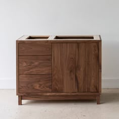 a wooden cabinet with two drawers on one side