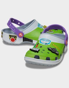 This Product Is Excluded From All Promotional Discounts And Offerscrocs X Disney Pixar Toy Story Buzz Lightyear Classic Clogs. Attention Star Command! The Exclusive Buzz Classic Clog Has Crash Landed On A Strange Planet. This Limited-Edition Style Features A Fully Wrapped Print Design Inspired By The Iconic Space Ranger Costume, Including Four Exclusive Jibbitz™ Charms. These Clogs Also Feature The Beloved “andy" Signature On The Inside Sole. Buzz Costume Printed Wrap Design. Includes 4 Exclusive Buzz-Themed Jibbitz™ Charms. Incredibly Light And Fun To Wear. Water-Friendly And Buoyant; Weighs Only Ounces. Ventilation Ports Add Breathability And Help Shed Water And Debris. Easy To Clean And Quick To Dry. Pivoting Heel Straps For A More Secure Fit. Customizable With Jibbitz™ Charms. Iconic C Toy Story Crocs, Buzz Costume, Ranger Costume, Space Ranger, Strange Planet, Toy Story Buzz Lightyear, Toy Story Buzz, Sneaker Sale, Pixar Toys