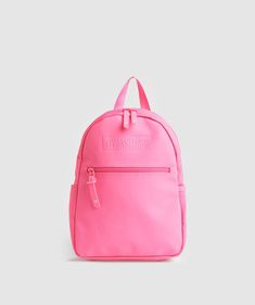 a pink backpack with the words love and sunshine on it, sitting against a white background