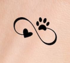 a dog's paw and heart tattoo is shown