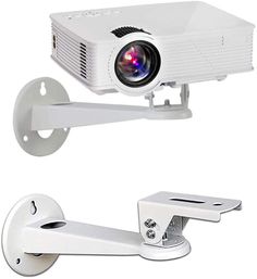 a white projector sitting on top of a wall next to a metal object holder