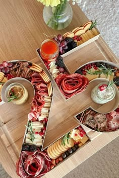 a wooden table topped with different types of food