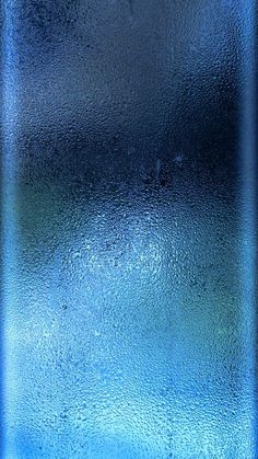 a close up view of a blue glass window