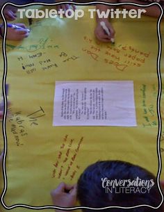 two children writing on a yellow paper with the words tabletop twitterr written on it