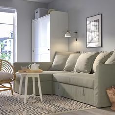 a living room filled with furniture next to a window