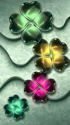 four leaf clovers on a metallic background