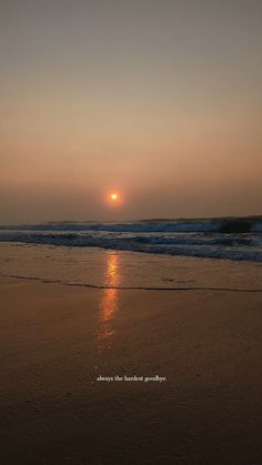 the sun is setting over the ocean with waves