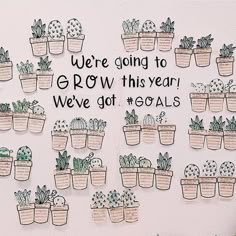 there are many potted plants with words written on the wall behind them that says, we're going to grow this year we've got goals