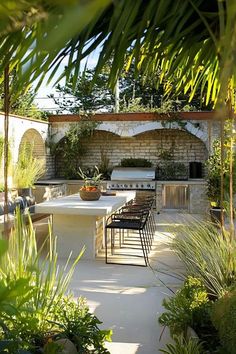 A beautiful rustic Mediterranean garden with olive trees, flowering plants, and natural stone pathways. Tuscan Backyard Ideas, Tuscan Backyard, Rustic Mediterranean, Garden Paradise