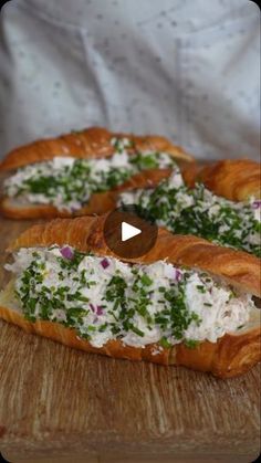 croissants filled with cheese and herbs on a cutting board