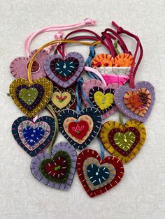 a bunch of heart shaped ornaments on a table