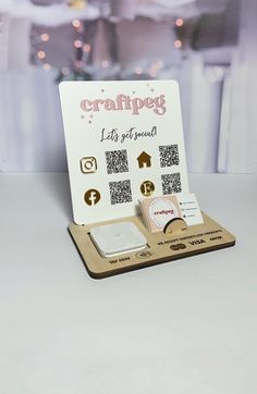 a craftpey display with qr code cards and magnets on the table